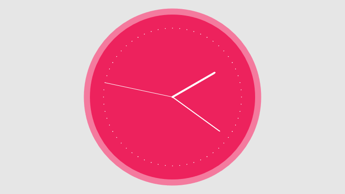 A pink clock on a grey background.